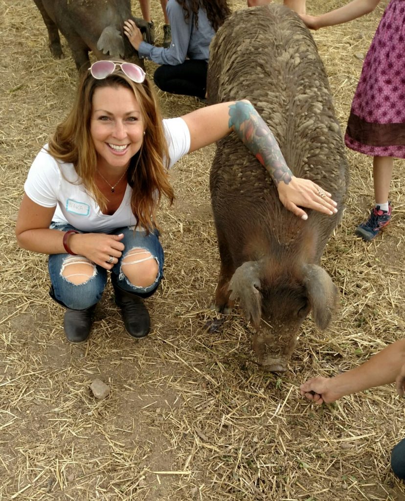 Sara Broom and One of Four Luvin' Arms Rescued Pigs