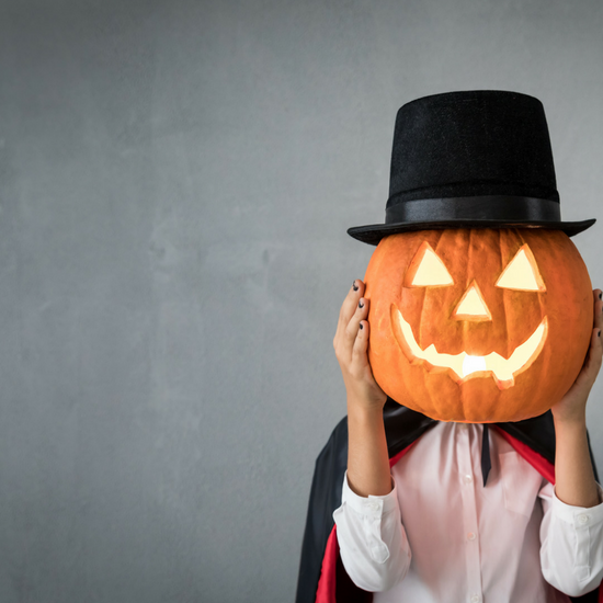 Child Holding Pumpkin