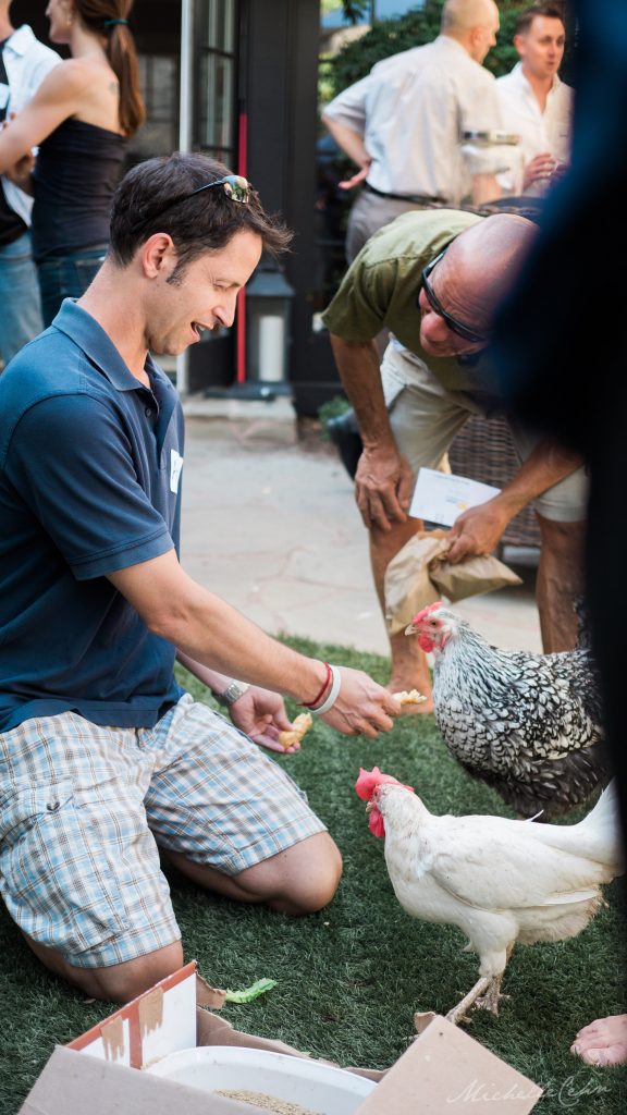 Ari Nessel and two of his rescued chickens